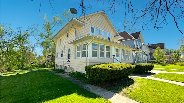 view of home's exterior featuring a lawn