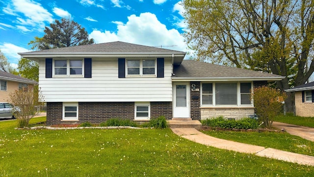 15612 Langley Ave, South Holland, IL 60473 - tri-level home featuring a front lawn and brick siding