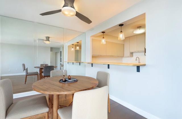 1560 N Sandburg Ter Unit 2506J, Chicago, IL 60610 - dining space featuring a ceiling fan, dark wood-style floors, and baseboards