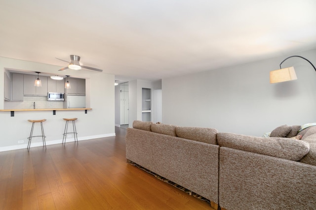 1560 N Sandburg Ter Unit 2506J, Chicago, IL 60610 - living area featuring dark wood-style floors, a ceiling fan, and baseboards