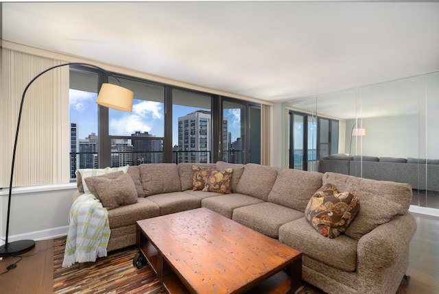 1560 N Sandburg Ter Unit 2506J, Chicago, IL 60610 - living room with wood finished floors, a view of city, and baseboards