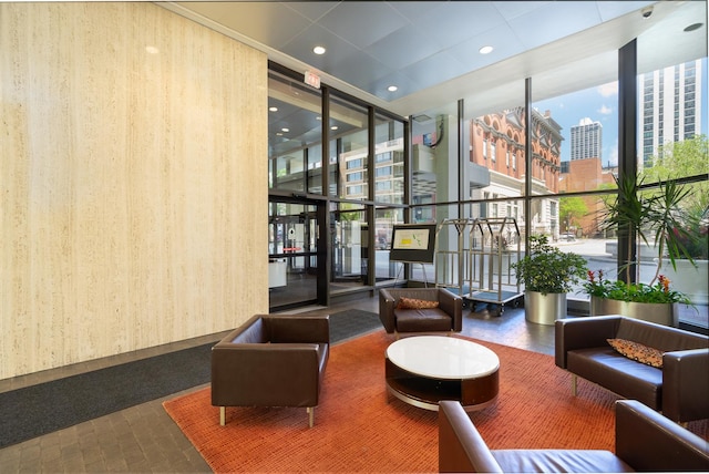 1560 N Sandburg Ter Unit 2506J, Chicago, IL 60610 - building lobby with a wall of windows, a view of city, and recessed lighting