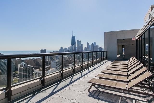 1560 N Sandburg Ter Unit 2506J, Chicago, IL 60610 - balcony featuring a skyline view and a water view