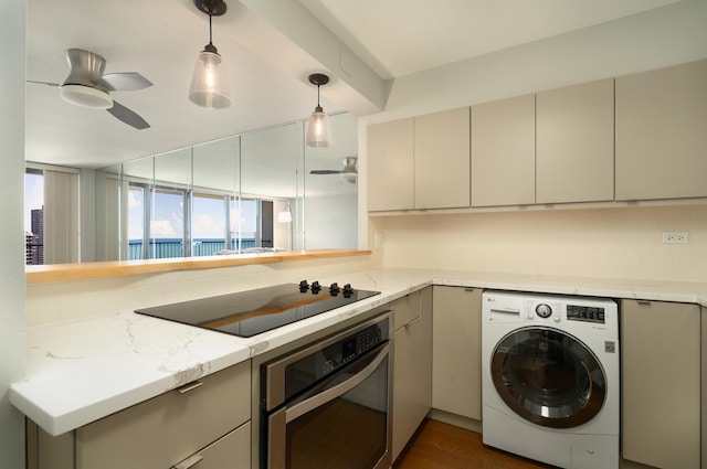 1560 N Sandburg Ter Unit 2506J, Chicago, IL 60610 - kitchen featuring washer / clothes dryer, stainless steel oven, ceiling fan, black electric stovetop, and pendant lighting