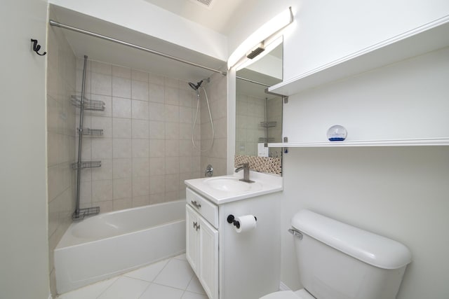 bathroom featuring tile patterned flooring, washtub / shower combination, toilet, and vanity
