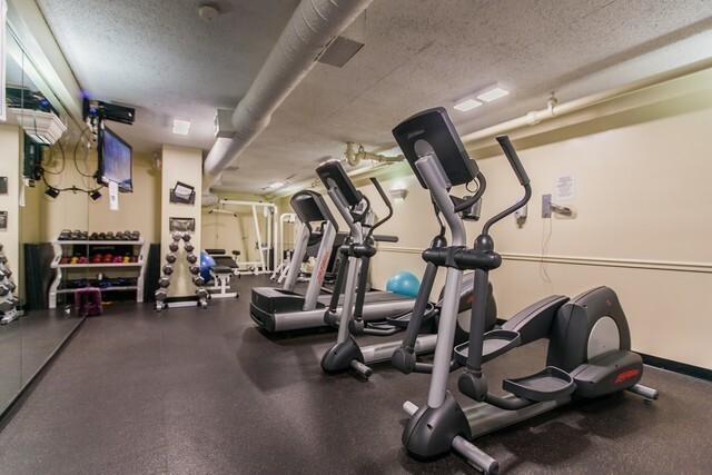 1560 N Sandburg Ter Unit 411J, Chicago, IL 60610 - gym with a textured ceiling