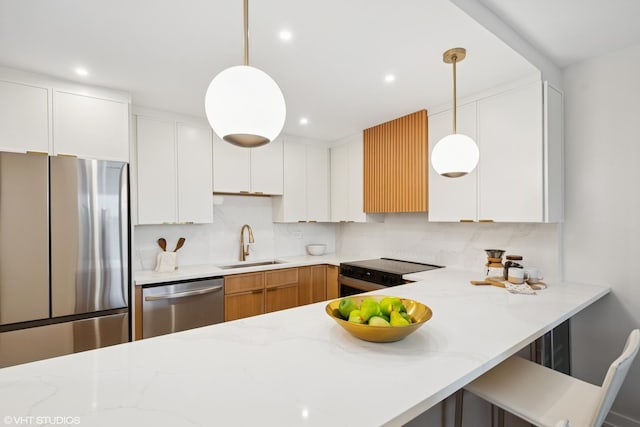 1560 N Sandburg Ter Unit 411J, Chicago, IL 60610 - kitchen with stainless steel appliances, a sink, light stone countertops, backsplash, and recessed lighting