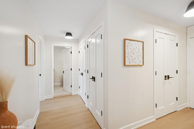 1560 N Sandburg Ter Unit 411J, Chicago, IL 60610 - hall with light wood-type flooring and baseboards