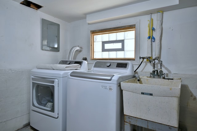 laundry area featuring washer and dryer and electric panel