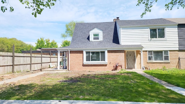 view of front of property featuring brick siding and a chimney