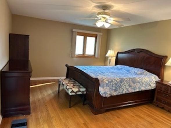 23105 N High Ridge Rd, Barrington, IL 60010 - bedroom featuring wood finished floors, baseboards, and ceiling fan