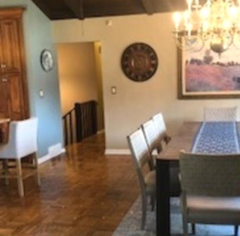 23105 N High Ridge Rd, Barrington, IL 60010 - dining room with a chandelier, baseboards, and vaulted ceiling