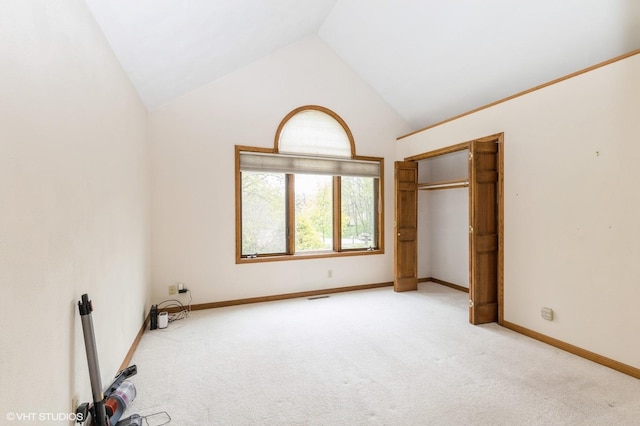 296 Regina Ln, Belvidere, IL 61008 - unfurnished bedroom with carpet floors, high vaulted ceiling, and baseboards
