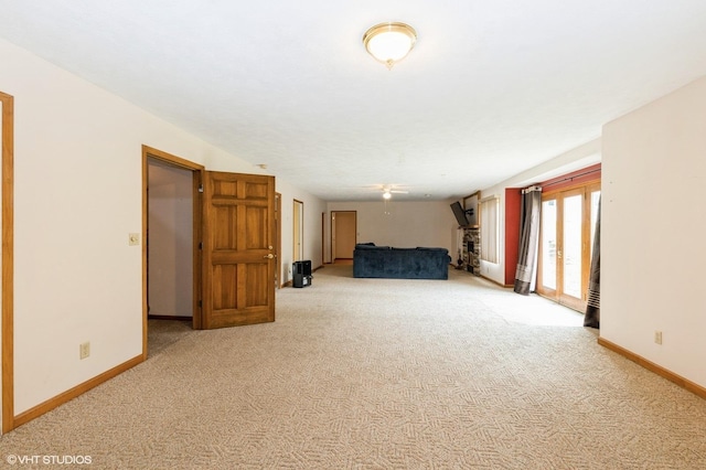 296 Regina Ln, Belvidere, IL 61008 - unfurnished living room featuring carpet flooring and baseboards