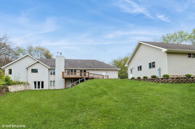 296 Regina Ln, Belvidere, IL 61008 - rear view of property with a yard, a wooden deck, and a chimney