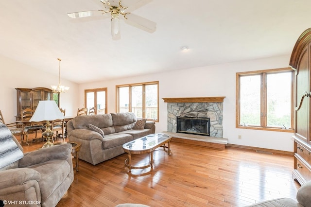 296 Regina Ln, Belvidere, IL 61008 - living area featuring healthy amount of natural light, vaulted ceiling, light wood-type flooring, and a chandelier