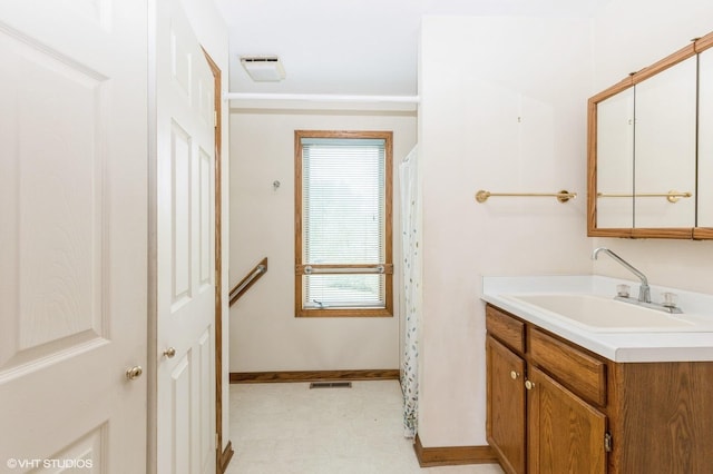 296 Regina Ln, Belvidere, IL 61008 - full bath featuring vanity, baseboards, tile patterned floors, and a shower with shower curtain