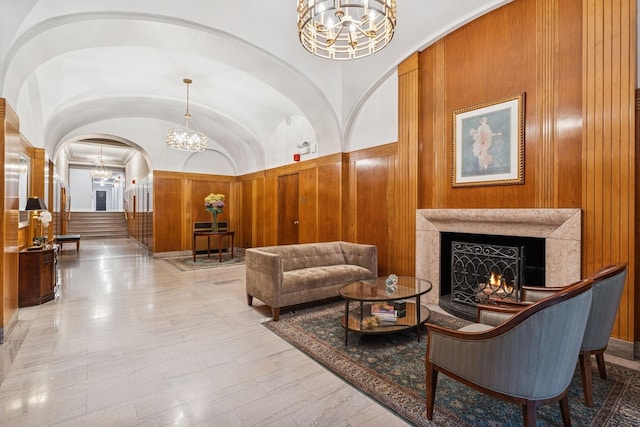 lobby with wood walls and vaulted ceiling