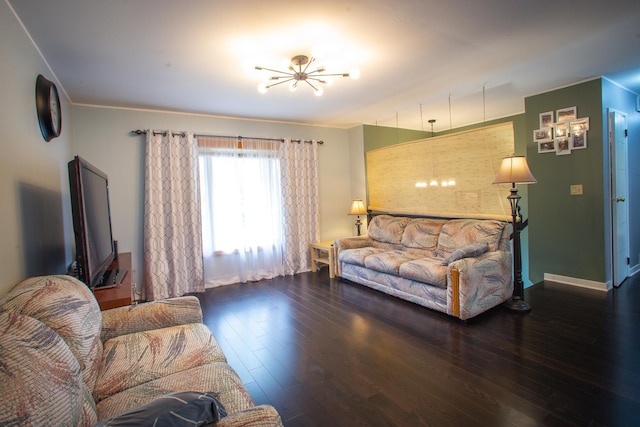 living area featuring a chandelier and wood finished floors