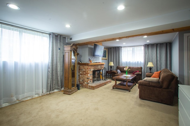 living area with carpet, a brick fireplace, and recessed lighting