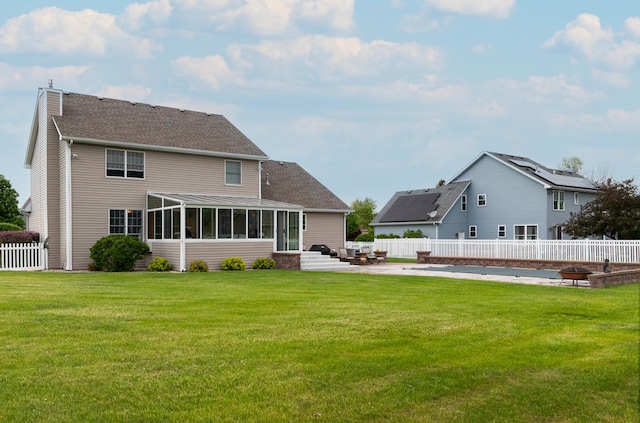 755 S Laura Ln, Diamond, IL 60416 - back of property with a sunroom, a chimney, a patio area, and a shingled roof