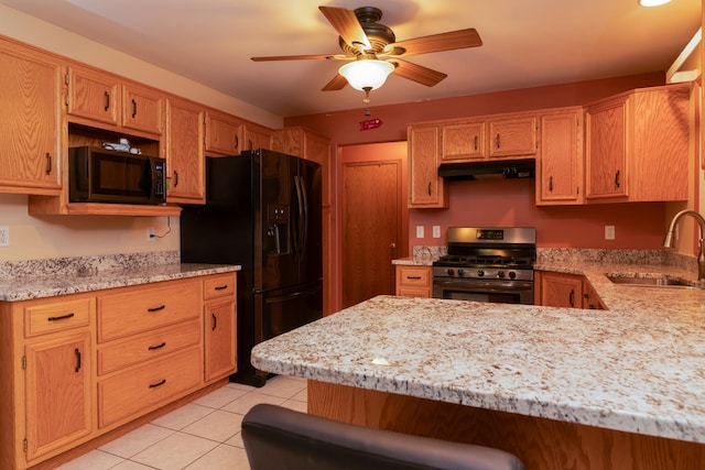 755 S Laura Ln, Diamond, IL 60416 - kitchen featuring black appliances, a sink, under cabinet range hood, a peninsula, and light tile patterned flooring
