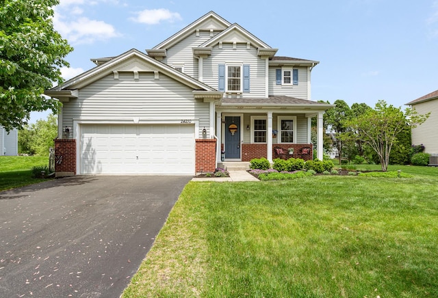 24210 Apple Creek Ln, Plainfield, IL 60586 - view of front of property with driveway, brick siding, a front lawn, and a garage