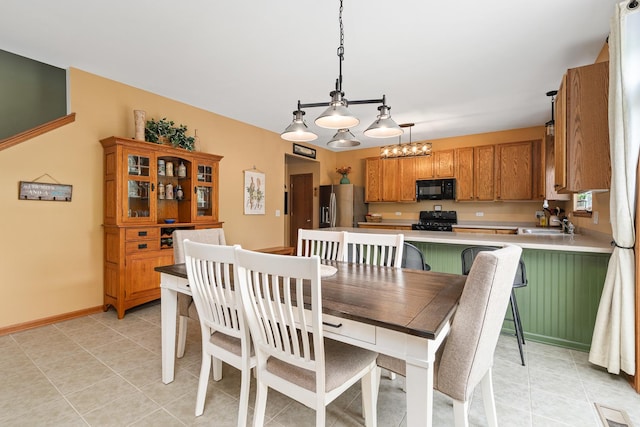 24210 Apple Creek Ln, Plainfield, IL 60586 - dining room featuring light tile patterned flooring and baseboards