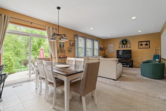 24210 Apple Creek Ln, Plainfield, IL 60586 - dining room featuring healthy amount of natural light, light tile patterned floors, recessed lighting, a chandelier, and light carpet
