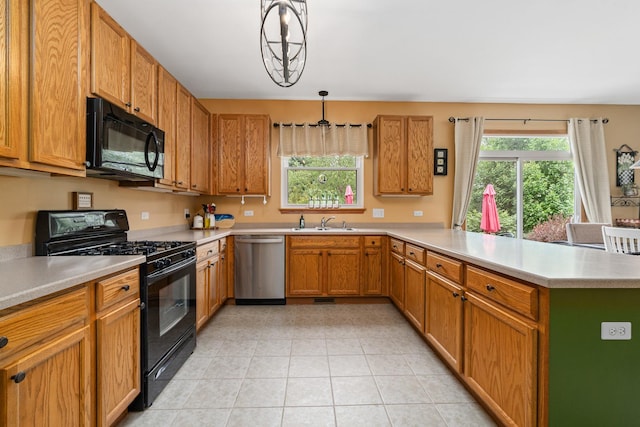 24210 Apple Creek Ln, Plainfield, IL 60586 - kitchen featuring black appliances, a sink, a peninsula, and light countertops