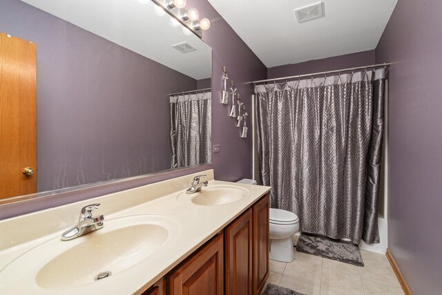 24210 Apple Creek Ln, Plainfield, IL 60586 - bathroom featuring tile patterned floors, toilet, double vanity, and a shower with shower curtain