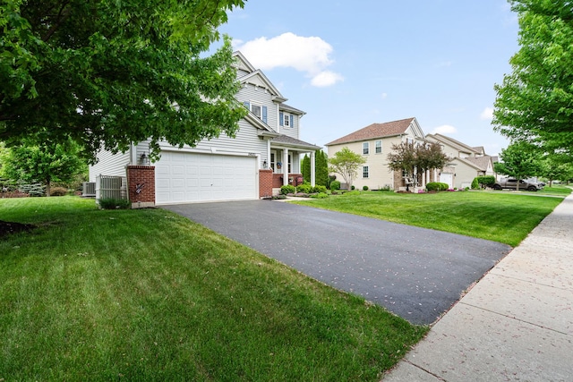 24210 Apple Creek Ln, Plainfield, IL 60586 - view of front of property featuring asphalt driveway, brick siding, a front yard, a residential view, and central air condition unit