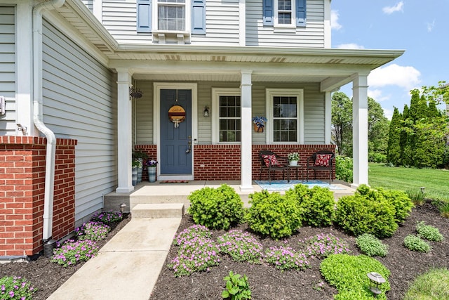 24210 Apple Creek Ln, Plainfield, IL 60586 - view of exterior entry with a porch and brick siding
