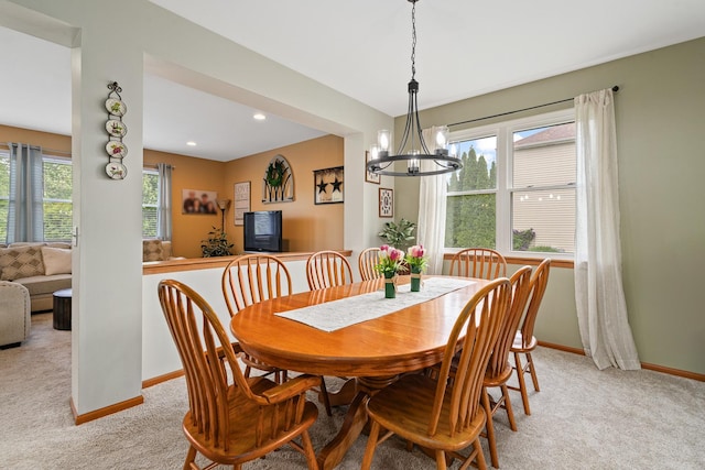 24210 Apple Creek Ln, Plainfield, IL 60586 - dining room featuring light carpet, baseboards, and a chandelier