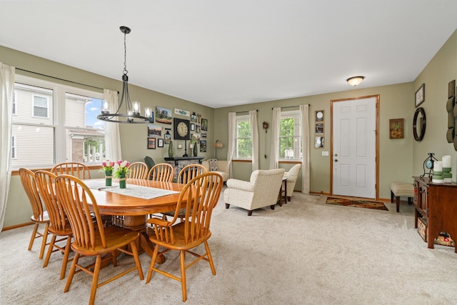 24210 Apple Creek Ln, Plainfield, IL 60586 - dining area featuring a chandelier, light colored carpet, and baseboards