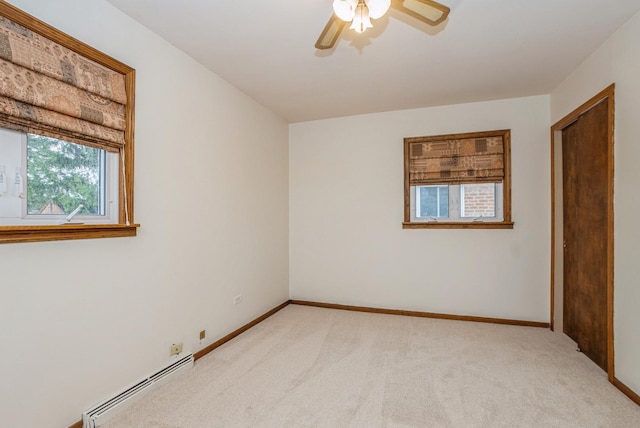 10756 Mason Ave, Chicago Ridge, IL 60415 - spare room with light colored carpet, baseboards, ceiling fan, and a baseboard heating unit