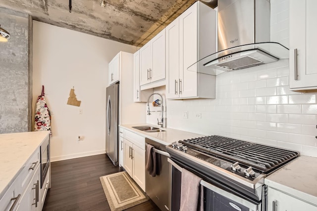 50 E 16th St Unit 1111, Chicago, IL 60616 - kitchen with wall chimney range hood, appliances with stainless steel finishes, dark wood-style flooring, a sink, and backsplash