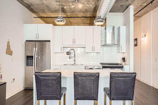 50 E 16th St Unit 1111, Chicago, IL 60616 - kitchen with wall chimney range hood, stainless steel appliances, a sink, dark wood-style floors, and tasteful backsplash
