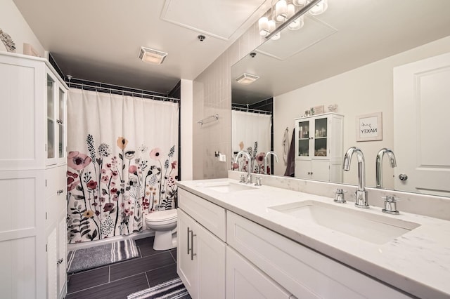50 E 16th St Unit 1111, Chicago, IL 60616 - full bath with toilet, double vanity, and a shower with curtain