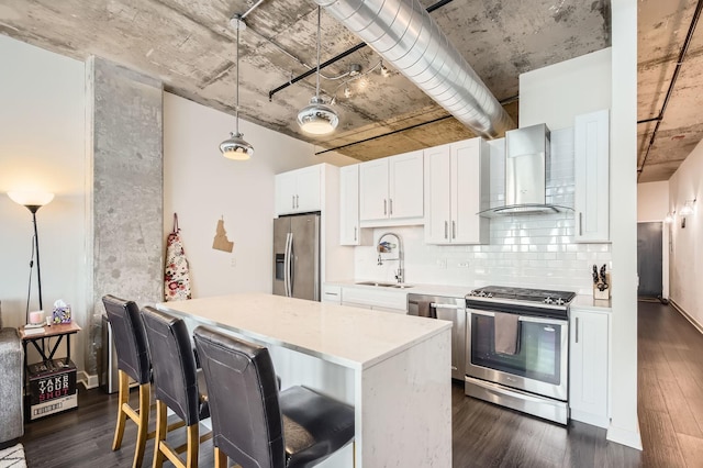 50 E 16th St Unit 1111, Chicago, IL 60616 - kitchen featuring stainless steel appliances, wall chimney range hood, a sink, light countertops, and decorative backsplash