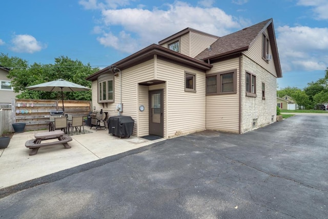 1607 Burlington Ave, Lisle, IL 60532 - back of house with a patio area, outdoor dining space, and roof with shingles
