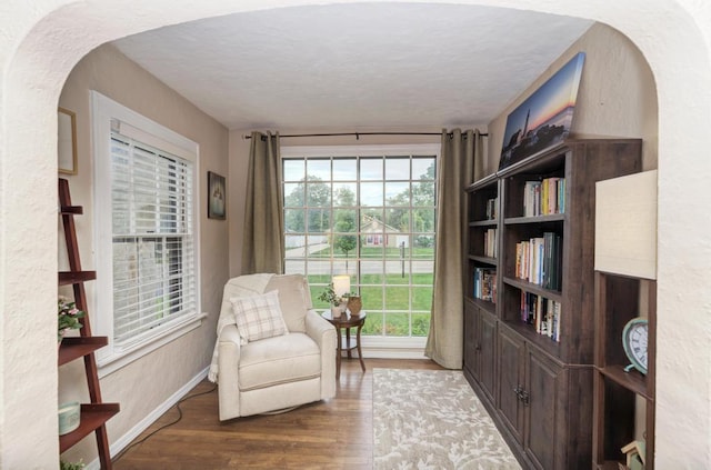 1607 Burlington Ave, Lisle, IL 60532 - living area with wood finished floors, arched walkways, baseboards, and a textured ceiling