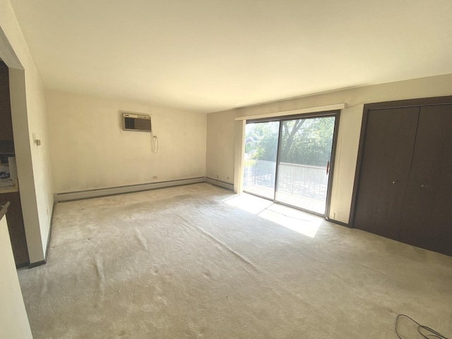 14643 Lamon Ave Unit 2A, Midlothian, IL 60445 - carpeted empty room featuring a wall unit AC, baseboards, and baseboard heating