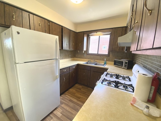 14643 Lamon Ave Unit 2A, Midlothian, IL 60445 - kitchen with white appliances, a sink, ventilation hood, light countertops, and dark wood-style floors