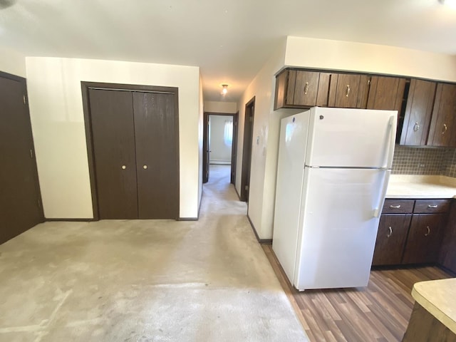 14643 Lamon Ave Unit 2A, Midlothian, IL 60445 - kitchen featuring freestanding refrigerator, dark brown cabinetry, backsplash, and light countertops