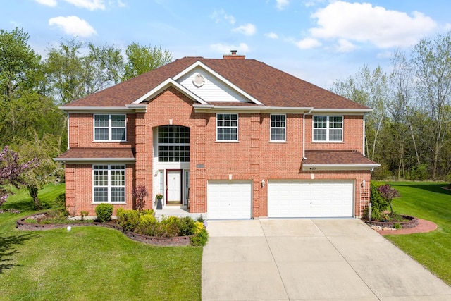 405 Lela Ln, Bartlett, IL 60103 - traditional-style house featuring an attached garage, driveway, a front lawn, and brick siding