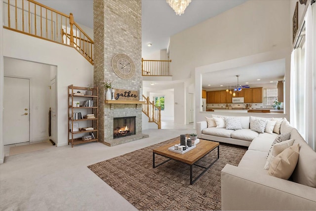 405 Lela Ln, Bartlett, IL 60103 - living room with a towering ceiling, light colored carpet, a fireplace, a chandelier, and recessed lighting