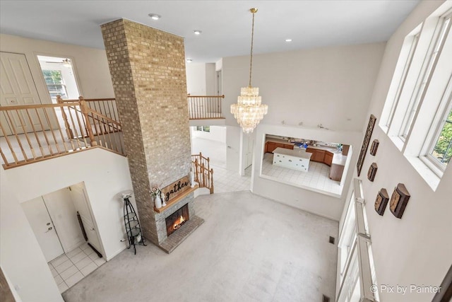405 Lela Ln, Bartlett, IL 60103 - living room featuring plenty of natural light, a chandelier, ceiling fan, a large fireplace, and recessed lighting