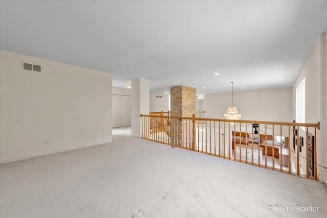 405 Lela Ln, Bartlett, IL 60103 - carpeted spare room with a chandelier and baseboards
