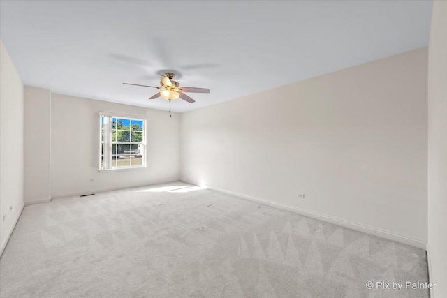 405 Lela Ln, Bartlett, IL 60103 - carpeted empty room with a ceiling fan and baseboards